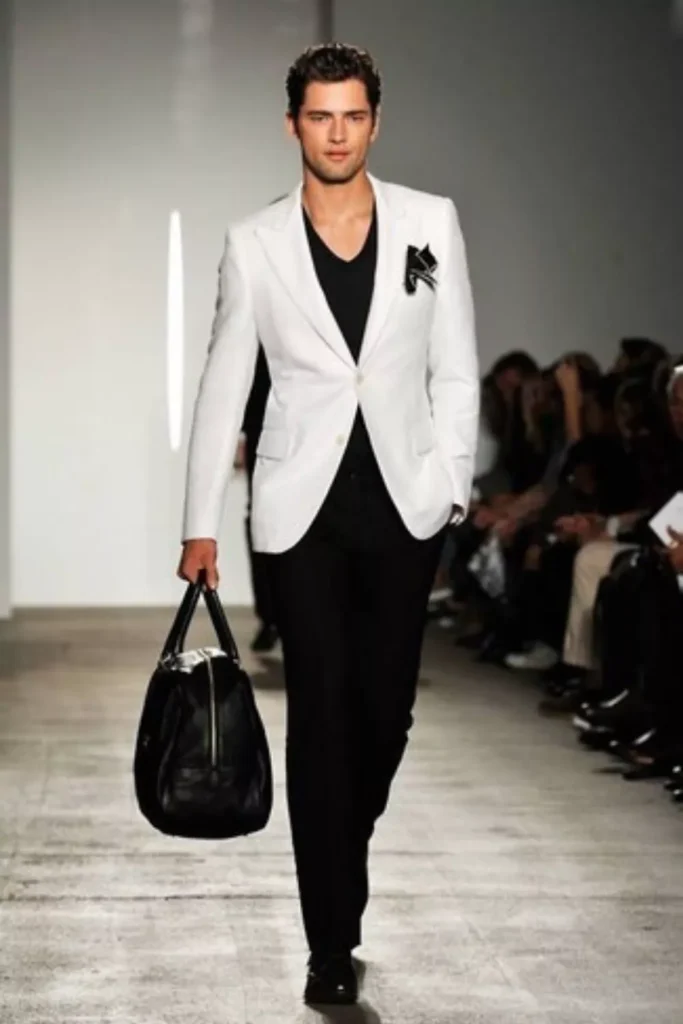 White Blazer + Black V-neck Shirt + Black Trousers + Black Dress Shoes + Black Leather Bag + Pocket Square