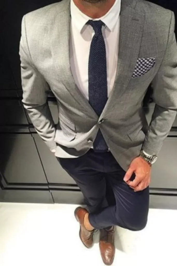 Light Grey Blazer + White Dress Shirt + Navy Blue Tie + Pocket Square + Navy Blue Trousers + Brown Leather Shoes + Watch