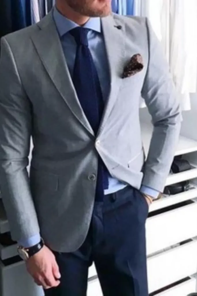 Light Grey Blazer + Light Blue Dress Shirt + Navy Blue Tie + Pocket Square + Navy Blue Trousers + Watch