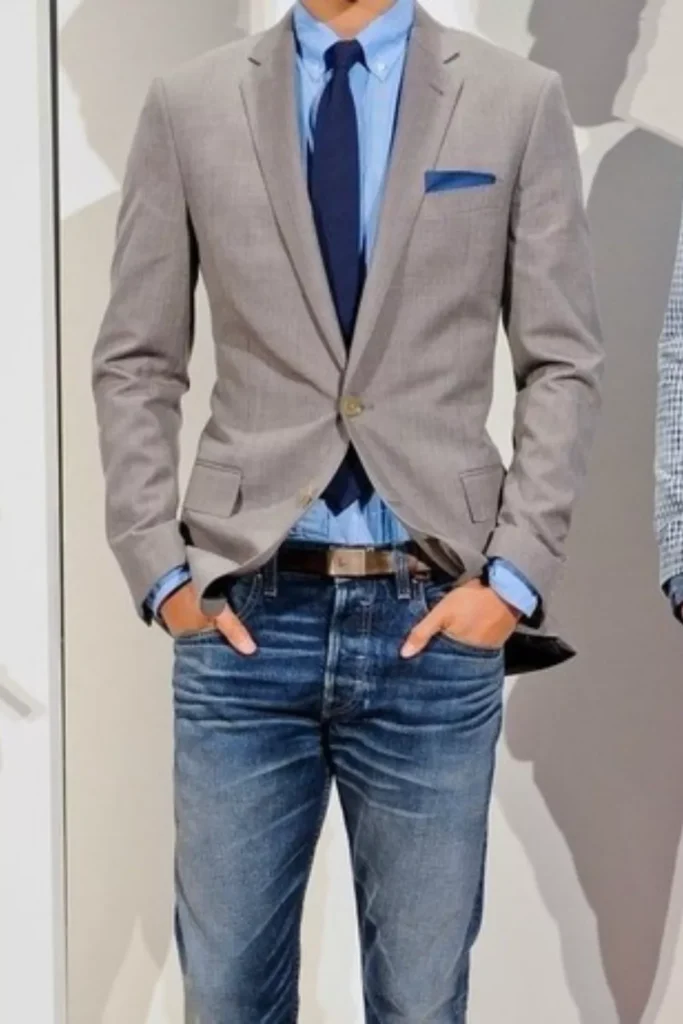 Gray Blazer + Light Blue Button-Down Shirt + Dark Blue Tie + Dark Blue Jeans + Brown Leather Belt