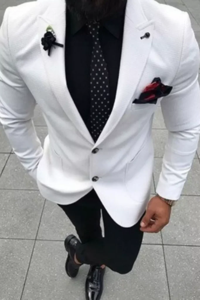White Blazer + Black Button-Down Shirt + Black Polka-Dot Tie + Black Trousers + Black Leather Shoes